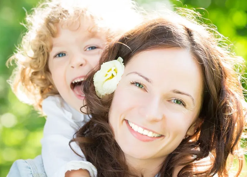 Illustration of a mother holding her infant, symbolizing the importance of early attachment for emotional health